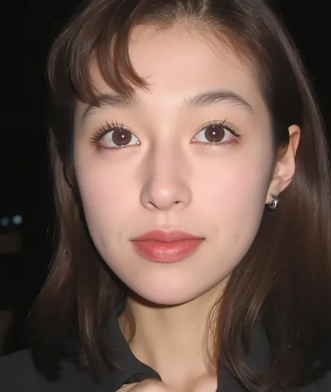 The image is a close-up photograph of a young Asian woman with a fair complexion. Her face dominates the frame, occupying the majority of the image, with her eyes, nose, and lips prominently visible. She has large, almond-shaped eyes with long, thick eyela...