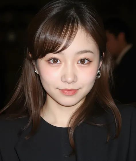 The image is a close-up photograph of a young Asian woman with a fair complexion. Her face dominates the frame, occupying the majority of the image, with her eyes, nose, and lips prominently visible. She has large, almond-shaped eyes with long, thick eyela...