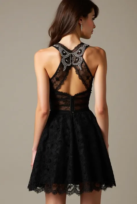 This charming and sophisticated dress combines sensuality and elegance. Short cocktail dress a dress made of delicate black lace gives the figure texture and depth. The transparent halter bodice is decorated with rhinestone appliqués, silhouette, resemblin...