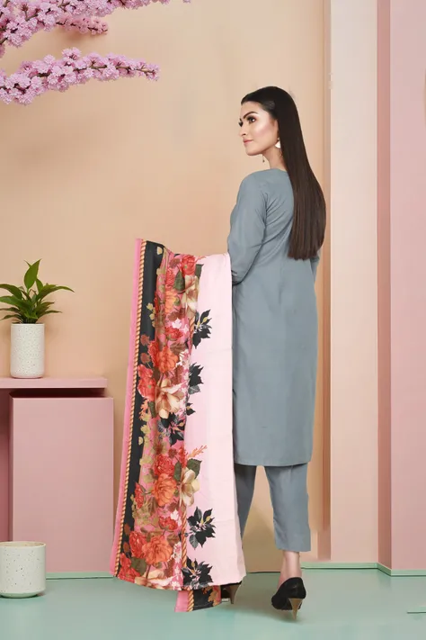 A woman wear gray shalwar kameez and modeling