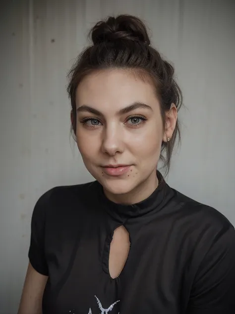 elizeryd, a woman, headshot, portrait, close up, smile, black tshirt, abstract print, bun, hair bun, short hair,