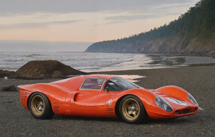 a photograph of a Tangerine Orange 4re33op4 sports car, (berlinetta:1.25), front 3/4 view, Olympic National Park, Washington: Experience the diverse landscapes from lush rainforests to rugged coastline at Ruby Beach., golden hour, 