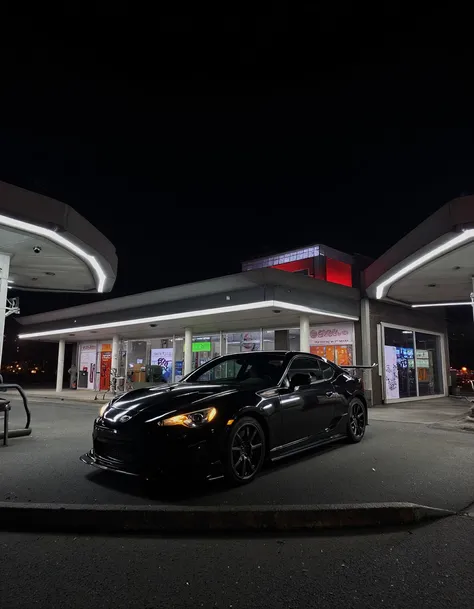 A sports car at a gas station at night. <lora:Aesthetic_Amateur_Photo_V4:1.25>