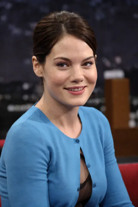 1girl, real photo, professional Getty Images style without watermark, actress being interviewed on a late-night show, smiling, studio backdrop, (close-up on face:1.2), blue shirt
 <lora:mm76_30s_us_lora_v01:1> mm76, brown hair