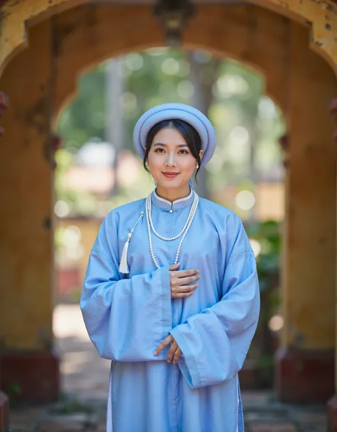 RC Hoang, Vietnamese, aodaiv10, The image is a portrait of a young woman wearing a traditional Chinese dress and a blue hat. She is standing in an archway with a blurred background. The woman is wearing a long blue robe with a white collar and a pearl neck...