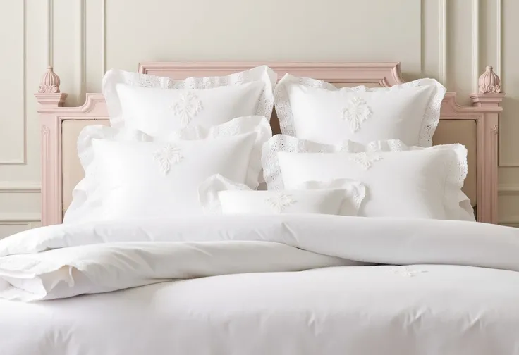 This photograph captures a feminine beautifully styled, elegantly decorated bedroom. The scene features a neatly made bed dressed in pristine white linens, including a duvet cover, and several european pillows, all adorned with delicate, intricate lace tri...