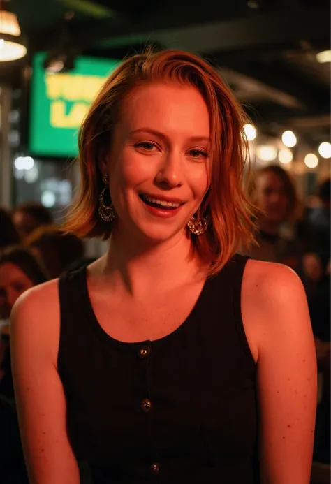 a portrait of Hannah Einbinder looking at the camera while performing a stand-up comedy act in a little pub