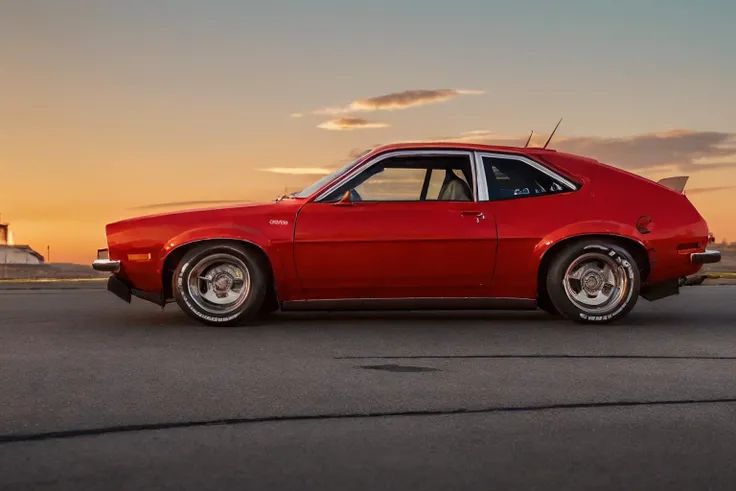 [<lora:Ford_Pinto:0.75>#cmd(cooldown(0.5))] , dutch angle view, realistic photo of a red pinto car, widebody, fender flares, racing wheels, imsa, scca, racing, sunset, golden hour, (masterpiece:1.0), (best quality:1.0), beautiful, (intricate details), unit...