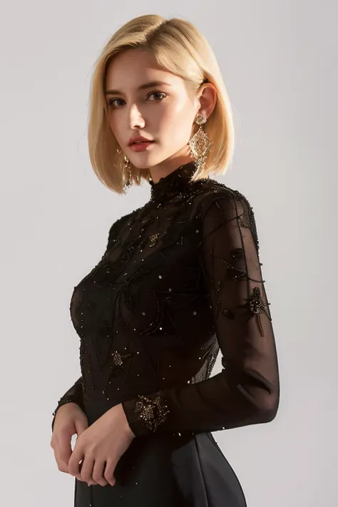 a woman in a black dress with sheer sleeves and a beaded top