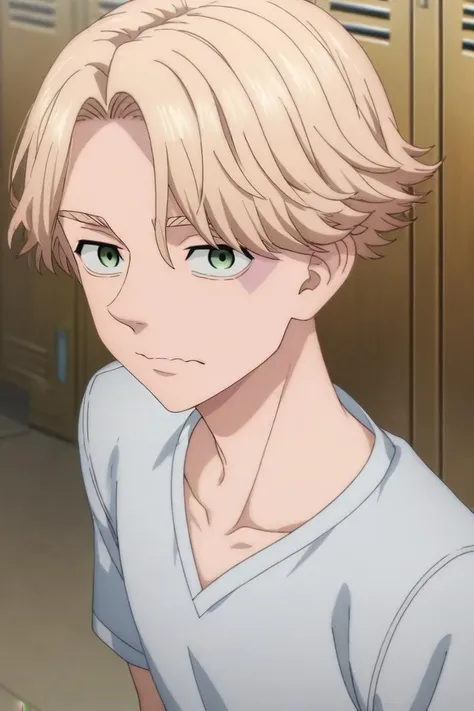 a young man with blonde hair and green eyes standing in front of a locker