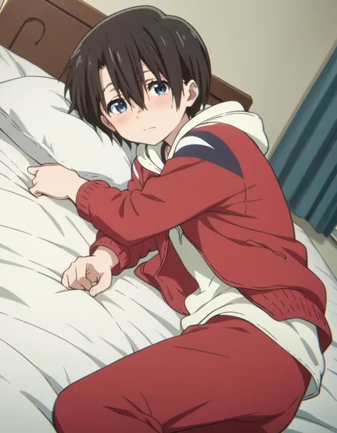 anime image of a young man in a red tracksuit sitting on a bed