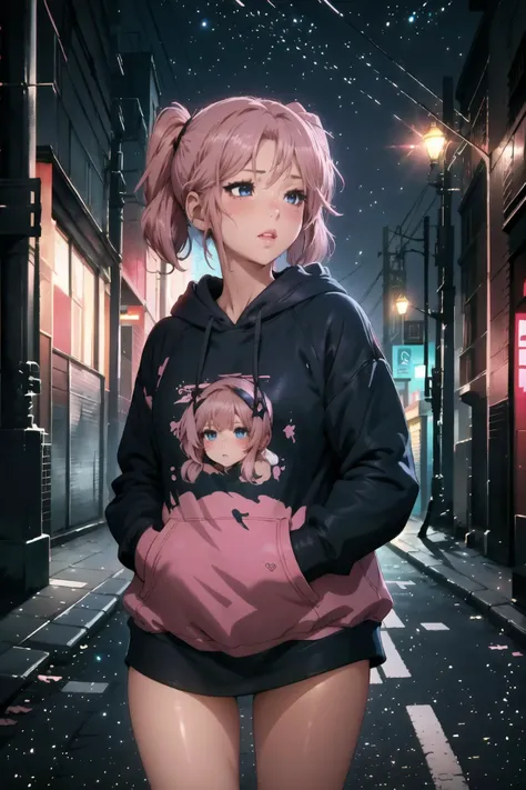 a woman in a hoodie standing on a city street