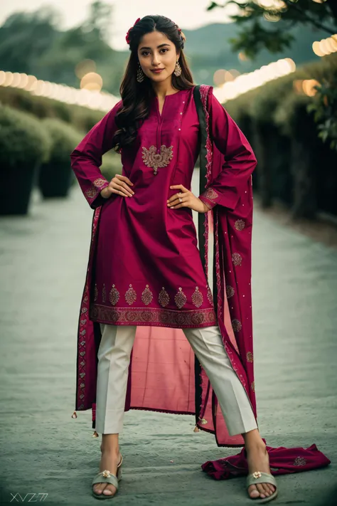 a woman in a maroon suit standing on a path