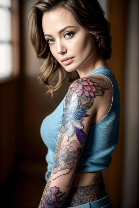 a woman with a tattoo on her arm and a blue top