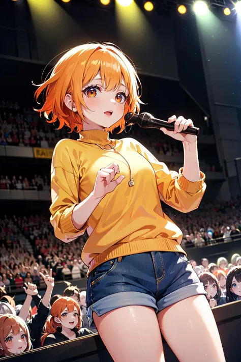 a close up of a person holding a microphone in front of a crowd