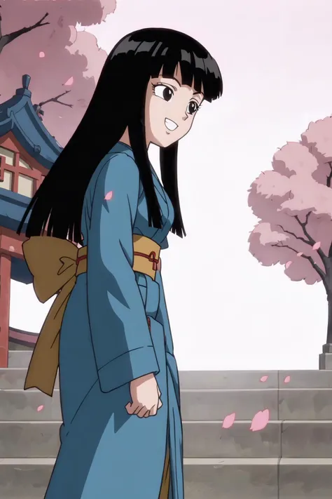 a woman in a blue kimono standing in front of a building