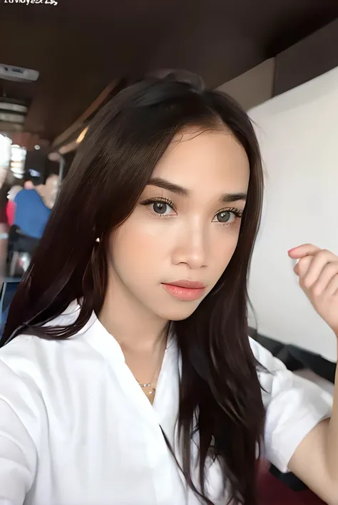 a close up of a woman with long hair wearing a white shirt