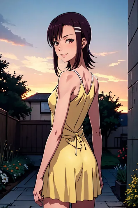 a woman in a yellow dress standing in a backyard