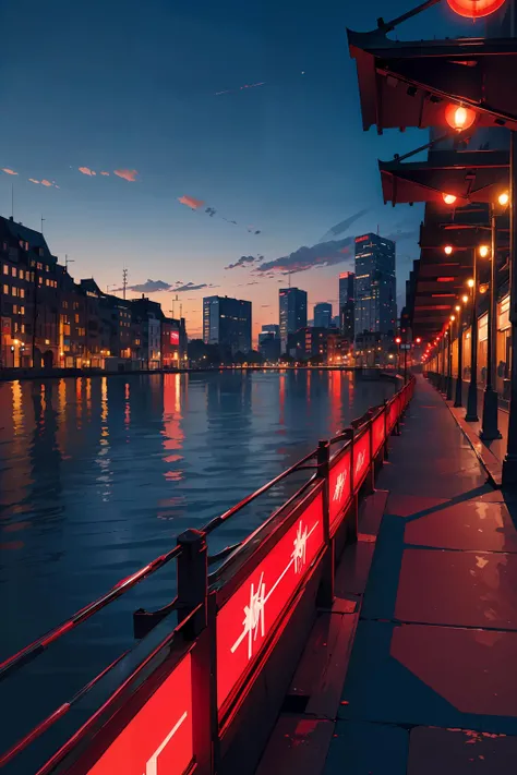 nighttime view of a city street with a river and a bridge