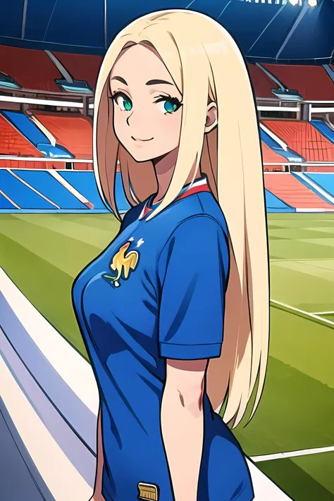 a close up of a woman in a blue shirt standing on a soccer field