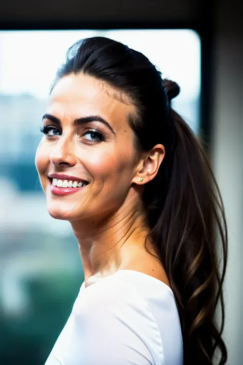 smiling woman with long hair in a white top and ponytail