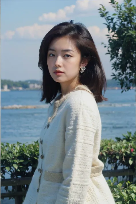 a close up of a woman standing near a body of water