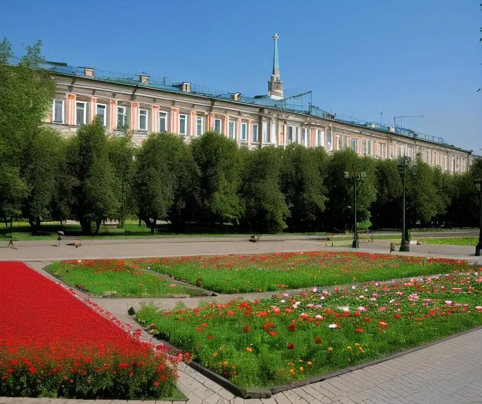 trees and flowers in a park with a building in the background