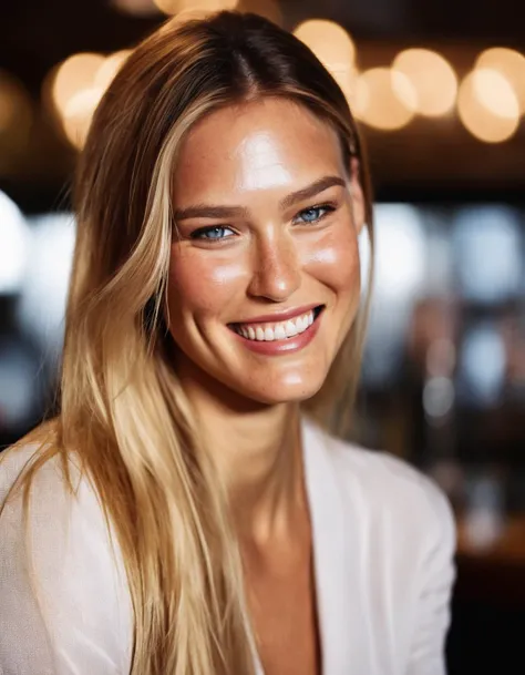 a close up of a woman with long blonde hair smiling