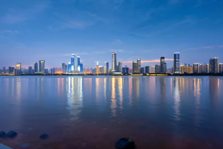 Beautiful view of the city skyline at night with a body of water, Hangzhou, shenzhen, shanghai, The skyline stands out, photography shot at blue hour, super wide view of a cityscape, Beautiful cityscape, twilight city on the background, Nanchang city, guan...