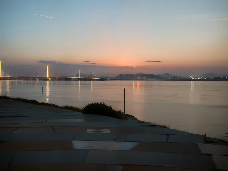 Araved view of the city skyline，There is a bridge and a piece of water, At sunrise, taken with sony alpha 9, taken at golden hour, the sea seen behind the city, taken with a Sony A7R camera, Sunset view, In the evening, late sunset, summer morning, taken w...