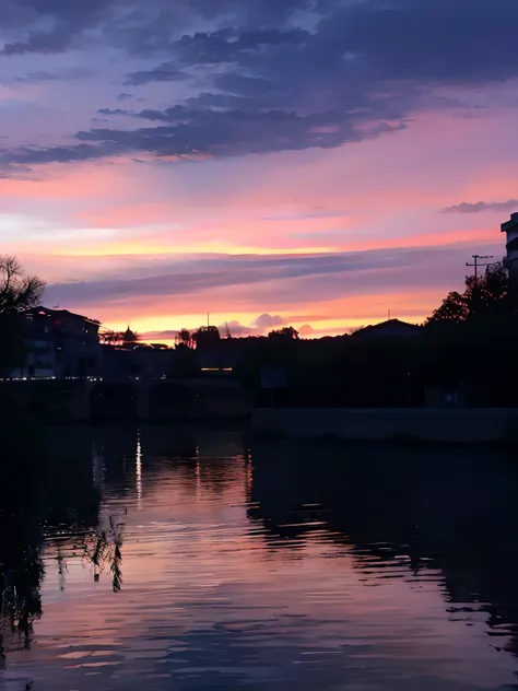 Sunset over the river，In the background is a bridge and a building, beautiful and spectacular dusk, sunsettime, pink sunset hue, The most beautiful sunset, dusk setting, beautiful dusk, Evening sunset, Sunset in the background, nice sunset, real sunset, Su...