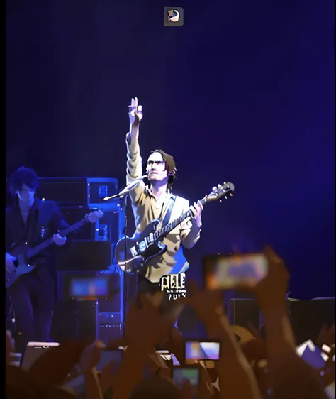 The Arafed man holds a guitar and microphone in front of a crowd, concert footage, Tom York (guitar), YouTube video screenshots, jonny greenwood (lead guitar), live, Execution, he is a rockstar, screengrab, jonny greenwood, concert photo, Tom York, Live co...