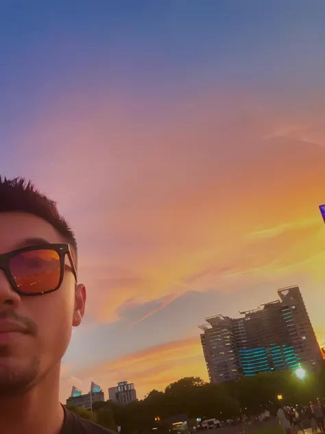 Arapei man in sunglasses standing in front of the colorful sunset, With sunset, vibrant sky, with a sunset, shot on gopro9, at a beautiful sunset, sunsettime, taken on go pro hero8, late sunset, 8k selfie photograph, In the sunset, real sunset, Colorful su...