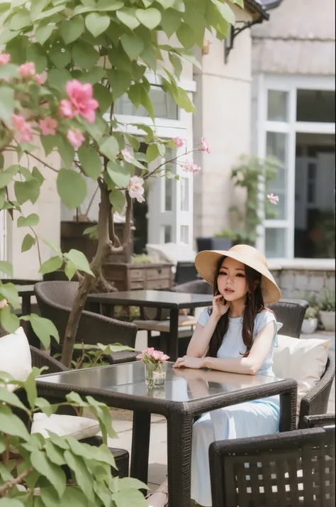 woman sitting at a table with a hat on and a flower in the background, at the terrace, ao dai, mai anh tran, in style of lam man...