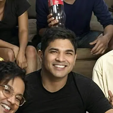 Smiling group of people sitting on a couch with a bottle of soda, taken in the early 2020s, foto do perfil, taken in the late 2010s, muito ligeiramente sorridente, tiradas no final dos anos 2000, david rios ferreira, foto de perfil, ligeiramente sorridente...