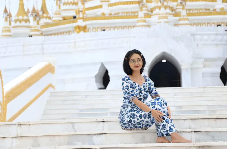 arafed woman sitting on steps in front of a white and gold building, sitting on temple stairs, in front of a temple, temples behind her, in a temple, in front of the temple, standing in a buddhist temple, medium shot portrait, wearing an ornate outfit, tem...