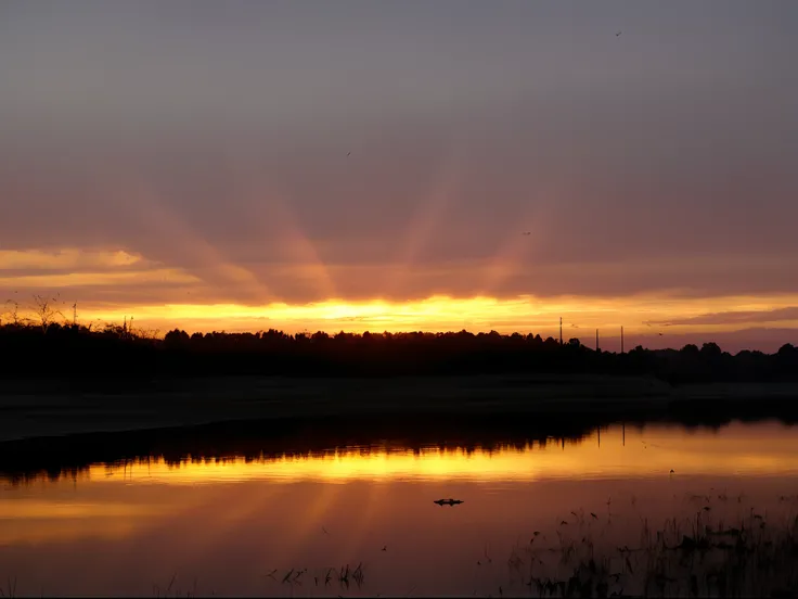 arafed view of a lake with a sunset in the background, refracted sunset, sun rays at sunset, refracted sunset lighting, sunbeams at sunset, early morning sunrise, beautiful sunrise lighting, crepuscular rays, water reflecting suns light, beautiful sunrise,...