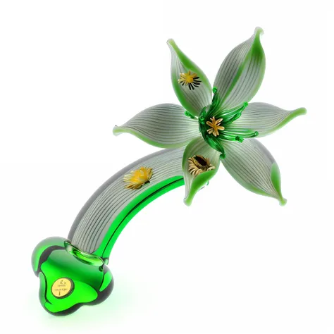 There is a green and white flower，The center is golden, stella alpina flower, the lilies, glass flowers, Lotus, alien flowers, melting into lilligant, 3/4 view from below, Murano glass sculpture, author：John Amlaide, metal orchid flower, flower power, larg...