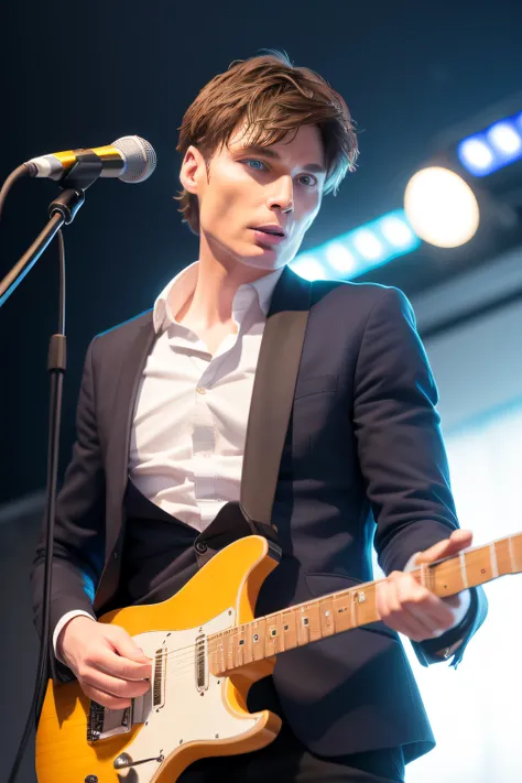 Cillian Murphy plays electric guitar