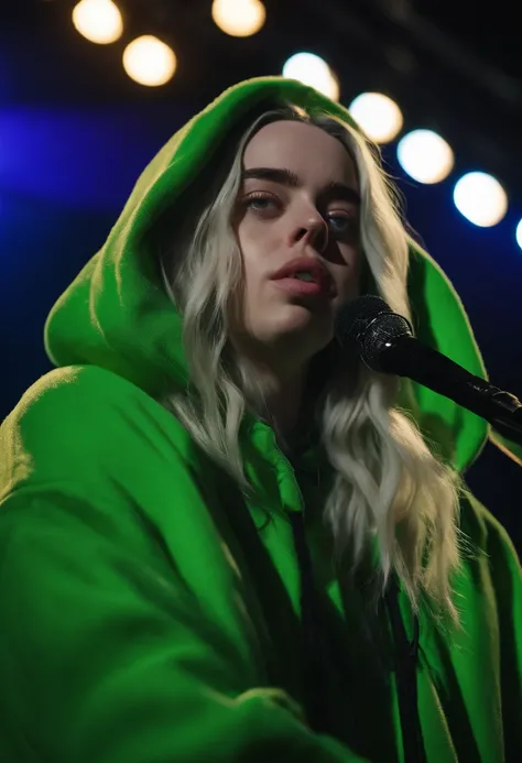 billie eilish with long wavy hair, wearing a vibrant green oversized hoodie tands confidently on stage under dazzling spotlights. Her captivating blue eyes shine with intensity as she passionately sings into the microphone