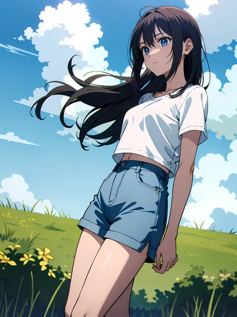 A girl , wearing a white t-shirt and shorts, standing in a grassy field with a blue sky in the background.