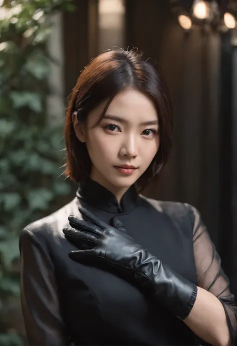 A young Japanese woman holding a black suit up to a shirt, a black leather glove worn in both hands, a womans hand with a black suit and black leather gloves in front of her