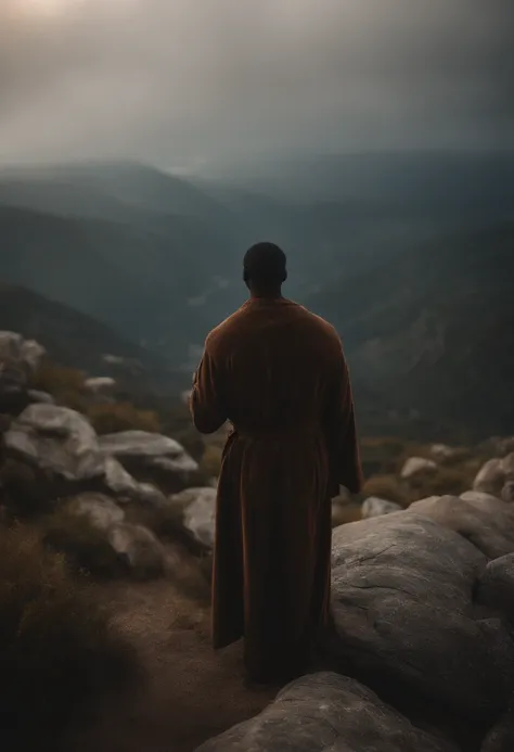 Rofeta Elijah with a robe in his hand on top of a mountain preaching to a crowd.(( with his disciple)