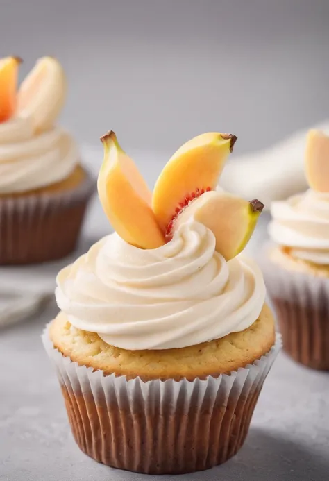 A banana cupcake with peach cream