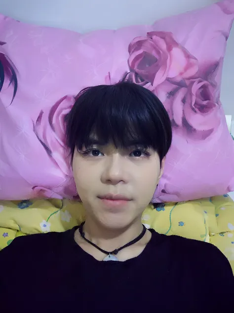 there is a man that is laying down with a pillow, with short hair, ruan cute vtuber, with long hair, wide forehead, halfbody headshot, thawan duchanee, selfie photo, with accurate face, south east asian with round face, 2 7 years old, on my bed, nivanh cha...