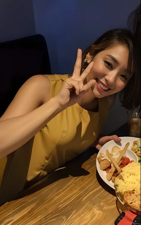 Woman in her 40s sitting at a table holding a plate of food, She is very beautiful,Im sending a peace sign with a smile,Breasts have C cups