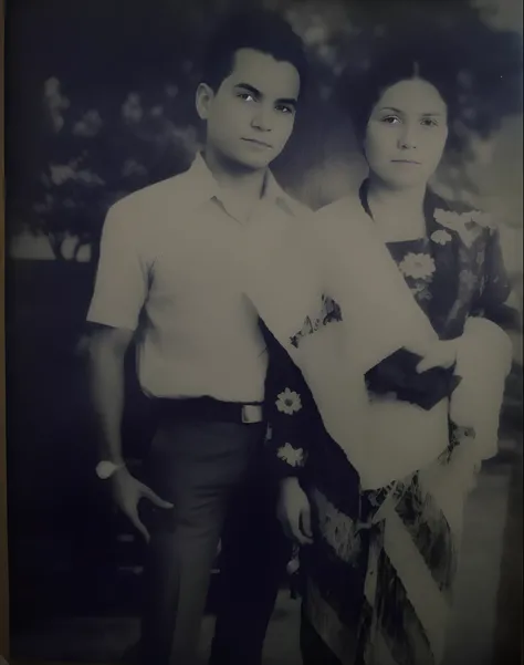 there is a black and white photo of a man and woman, momma and papa, old photo, very old photo, an old balck and white photo, old style photo, old photograph, old picture, aged photo, lost photo, black and white old photo, old black and white photo, old ph...