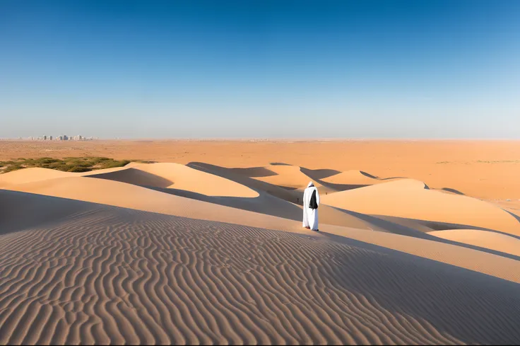 Old arab man in traditional clothing standing on a sand dune. Looking at a modern city in the distance.