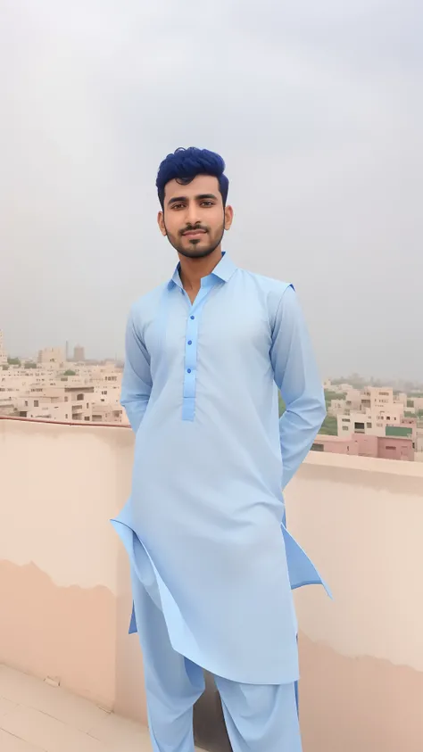 arafed man in blue shirt standing on a roof with a city in the background, very very low quality picture, kyza saleem, wearing a kurta, khyzyl saleem, very clear picture, full body picture, traditional clothes, blue colored traditional wear, around 1 9 yea...