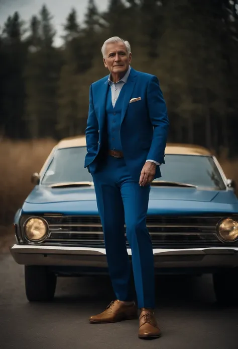 Portrait of a graying man in blue suit with golden shirt blue pants brown shoe in front of a blue vehicle with gold